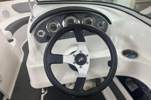 Slide: The Image of Steering wheel and dashboard of 2011 Sea Ray 205 Sport boat. - 28