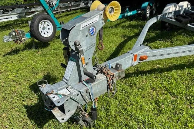 Slide: The Image of Trailer hitch for 2011 Sea Ray 205 Sport boat on grassy area. - 26