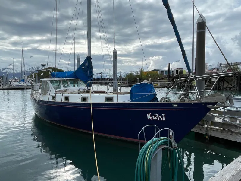 The Image of 1979 Formosa 46 Cutter sailboat docked in a marina under cloudy skies. - 0