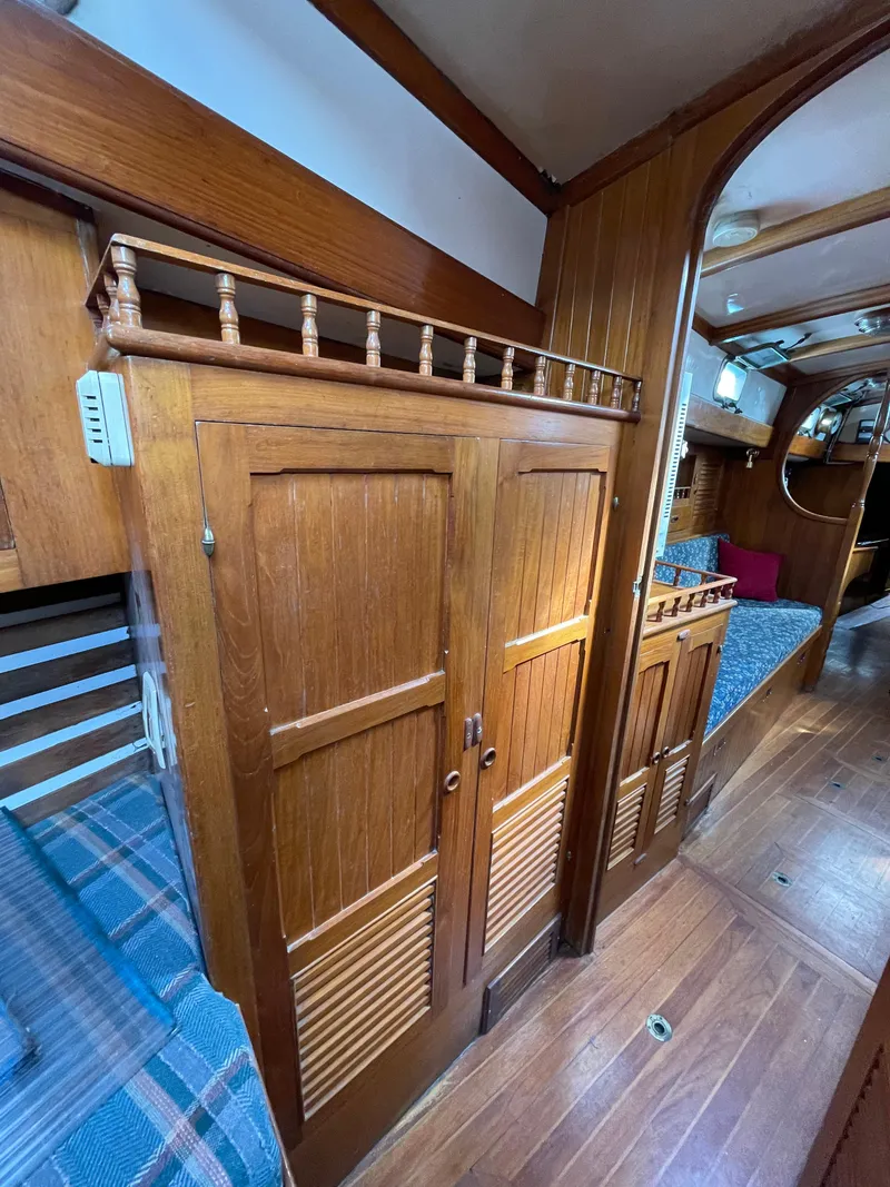 Slide: The Image of 1979 Formosa 46 Cutter interior with wooden cabinetry and cozy sleeping area. - 20