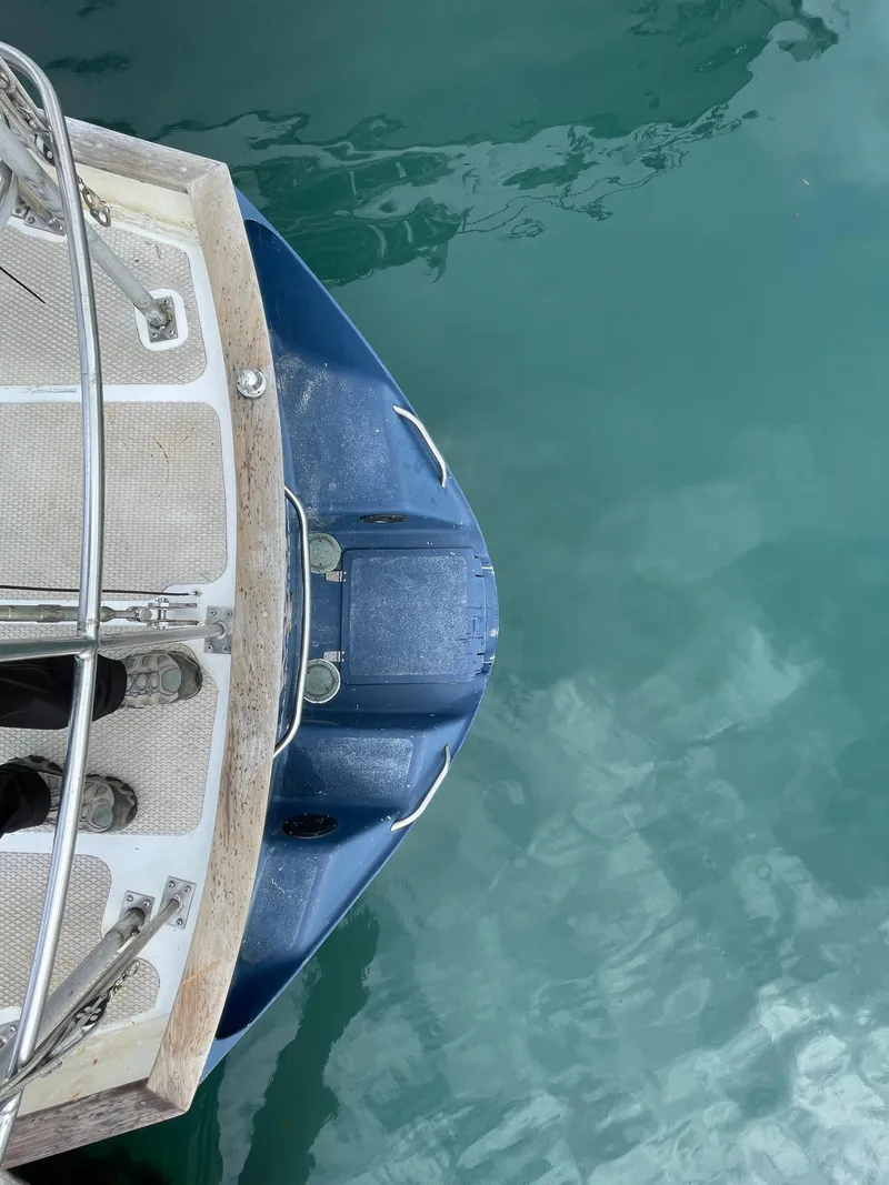 Slide: The Image of Bow of 1979 Formosa 46 Cutter sailboat on calm turquoise water. - 21