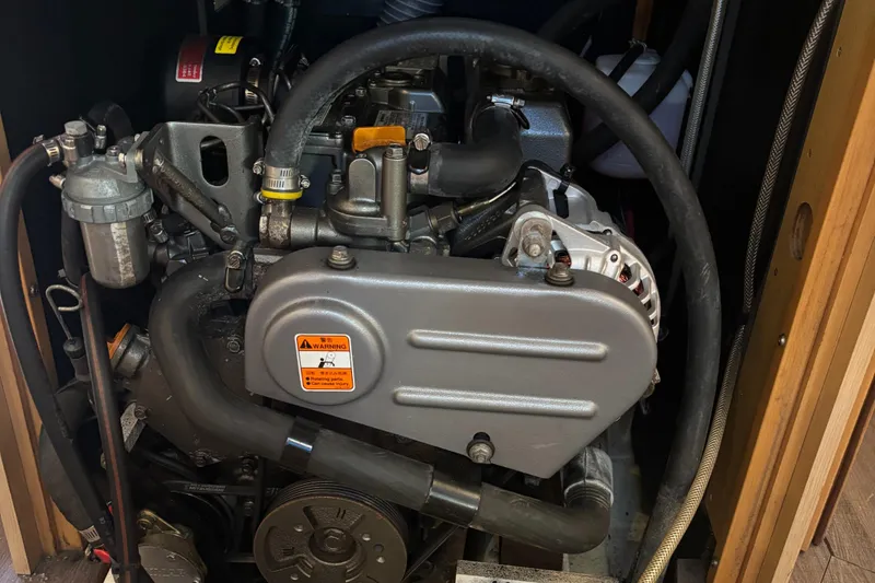 Slide: The Image of Engine compartment of a 2015 Beneteau Oceanis 35 sailboat, showcasing mechanical components. - 18