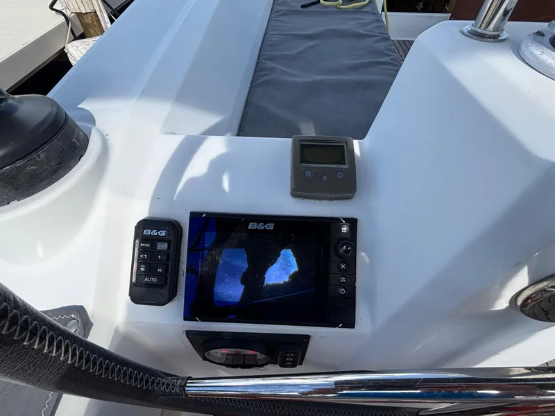Slide: The Image of Cockpit of 2015 Beneteau Oceanis 35 with navigation equipment and controls. - 6