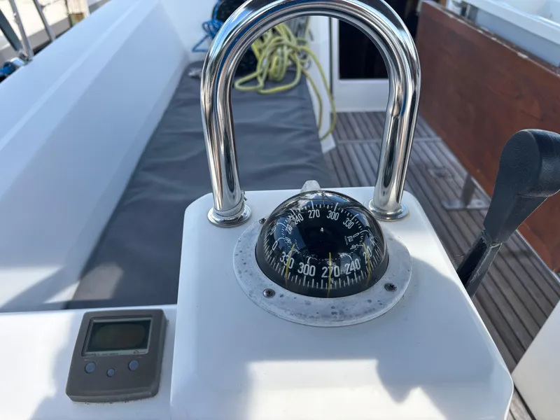 Slide: The Image of Compass and controls on a 2015 Beneteau Oceanis 35 sailboat deck. - 8