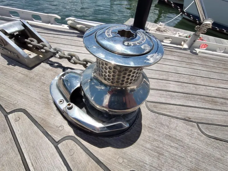Slide: The Image of Chrome winch on 1982 Ta Shing Tatoosh 42 sailboat deck, near water. - 11