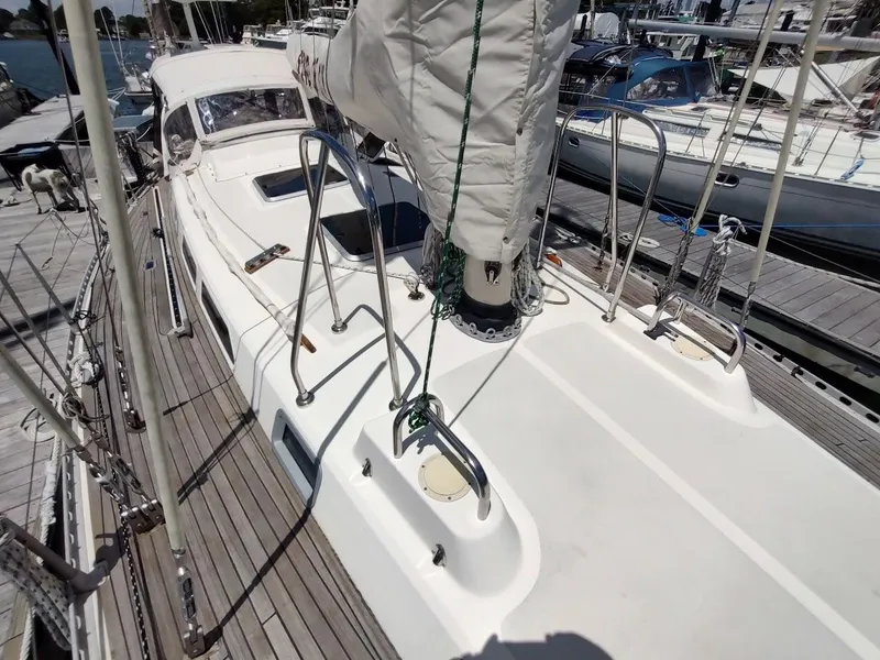 Slide: The Image of 1982 Ta Shing Tatoosh 42 sailboat deck with rigging and marina background. - 14