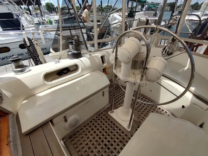 Slide: The Image of 1982 Ta Shing Tatoosh 42 sailboat cockpit with steering wheel and winches at marina. - 22