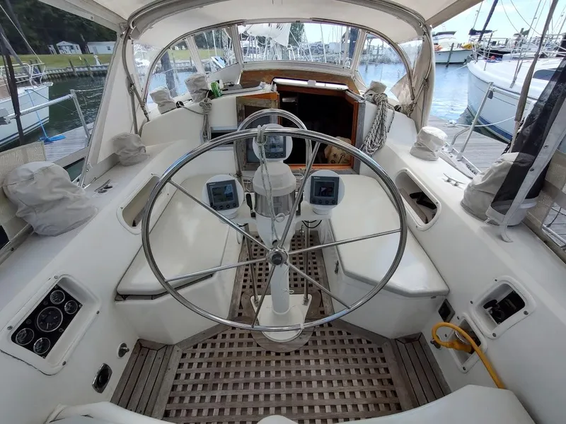 Slide: The Image of Cockpit of 1982 Ta Shing Tatoosh 42 sailboat with steering wheel and navigation instruments. - 24