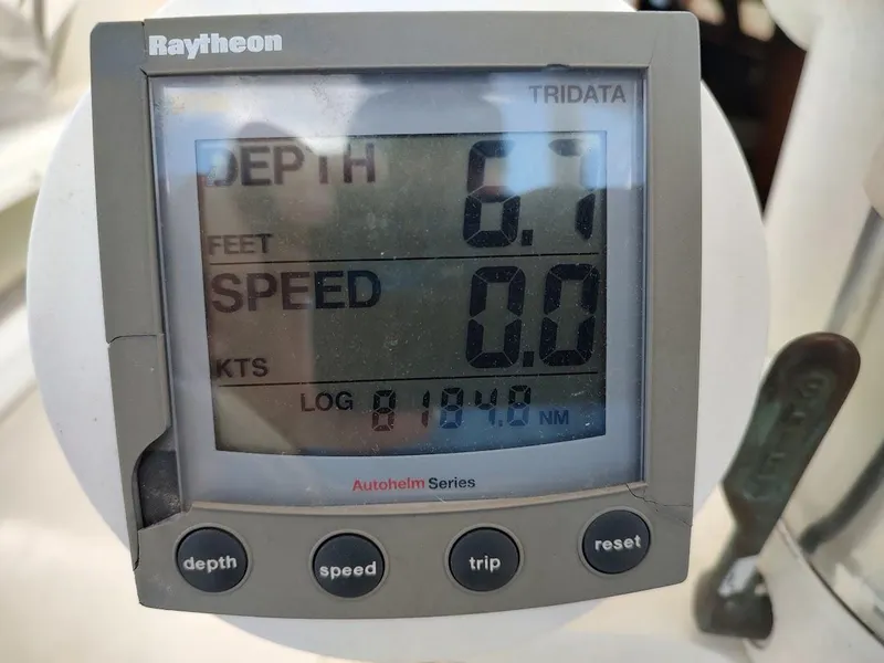 Slide: The Image of Raytheon Tridata display showing depth 6.7 feet, speed 0.0 knots on Tatoosh 42 yacht. - 25