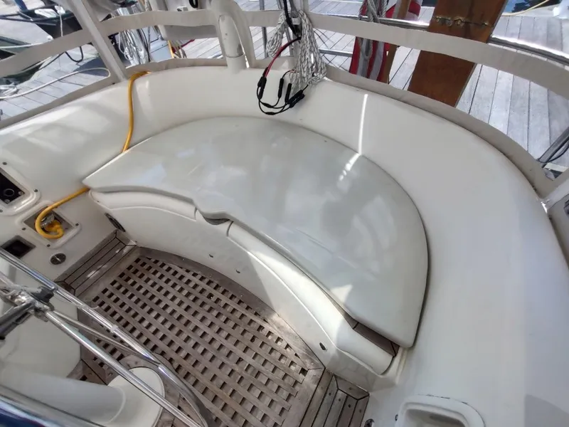 Slide: The Image of Cockpit seating area of 1982 Ta Shing Tatoosh 42 sailboat with wooden flooring. - 42