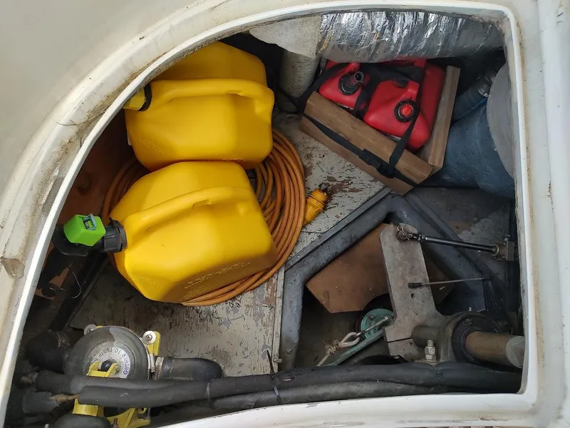 Slide: The Image of Storage compartment of 1982 Ta Shing Tatoosh 42 with fuel containers and equipment. - 45