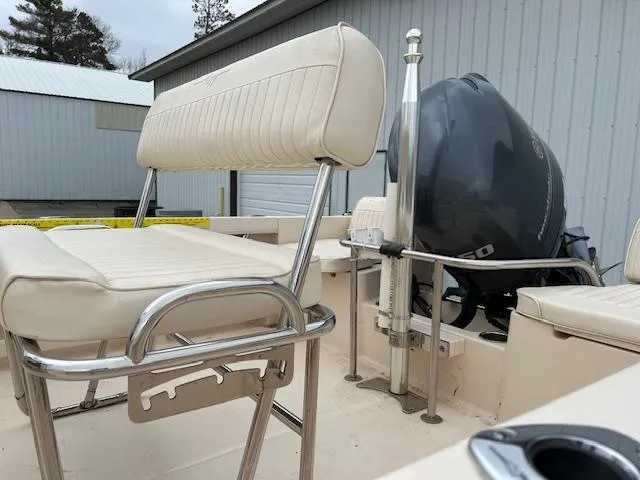 Slide: The Image of 2013 Grady-White Fisherman 180 boat interior with seating and outboard motor. - 15