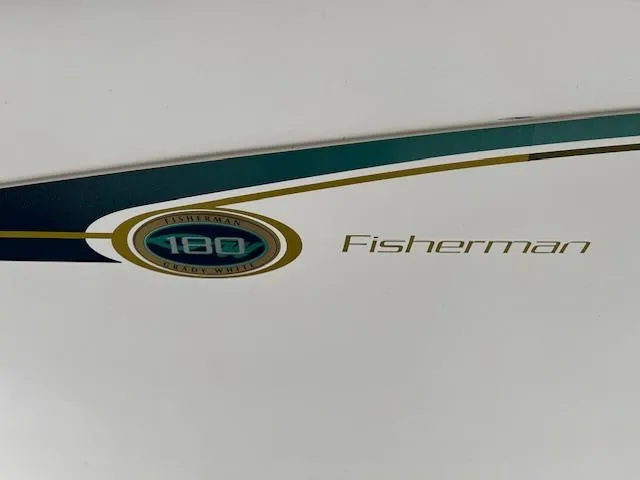 Slide: The Image of 2013 Grady-White Fisherman 180 logo on boat hull. - 3