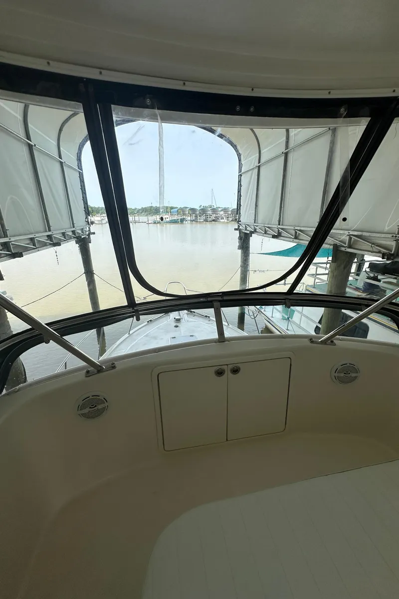 Slide: The Image of Interior view of 2002 Riviera 350 yacht with marina backdrop. - 17