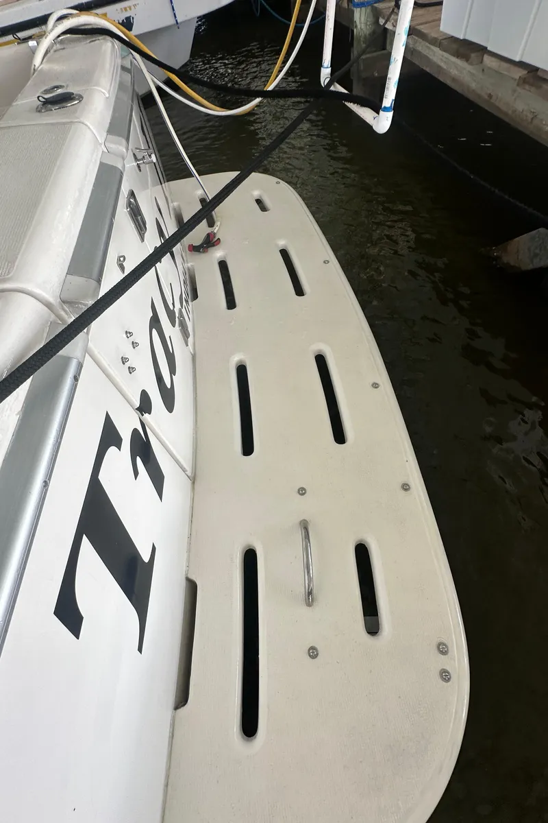 Slide: The Image of Riviera 350 boat swim platform, 2002 model, docked in marina. - 21