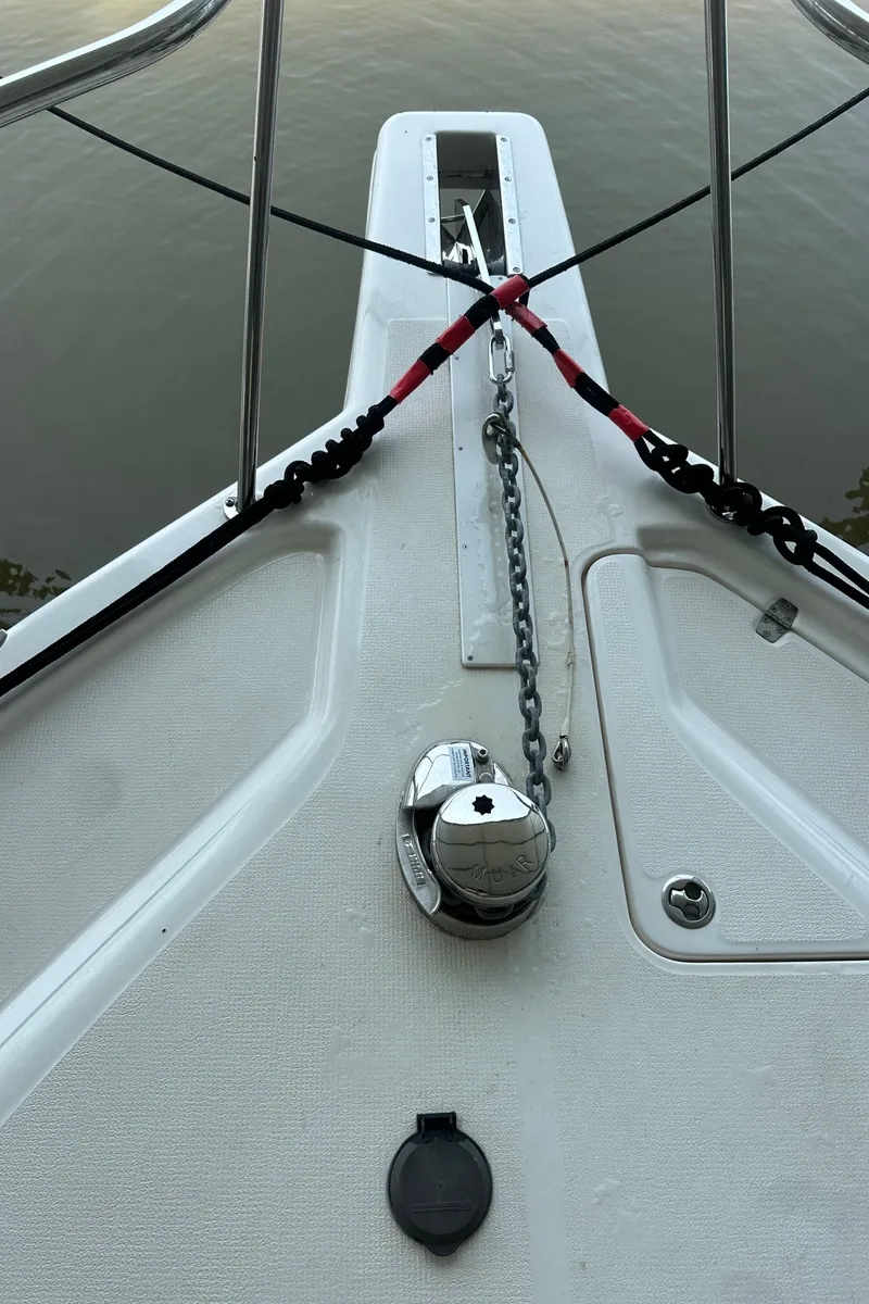 Slide: The Image of Bow of 2002 Riviera 350 boat with anchor chain and railing. - 23
