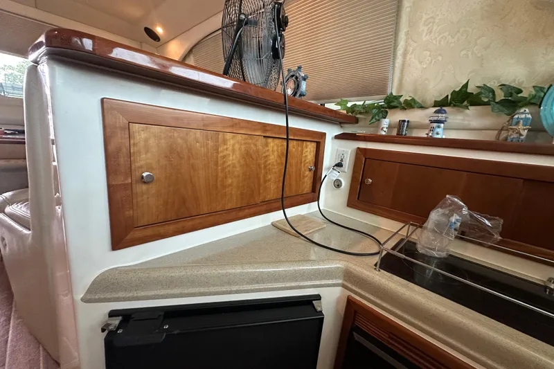 Slide: The Image of Interior of a 2002 Riviera 350 yacht with wooden cabinetry and countertop. - 30