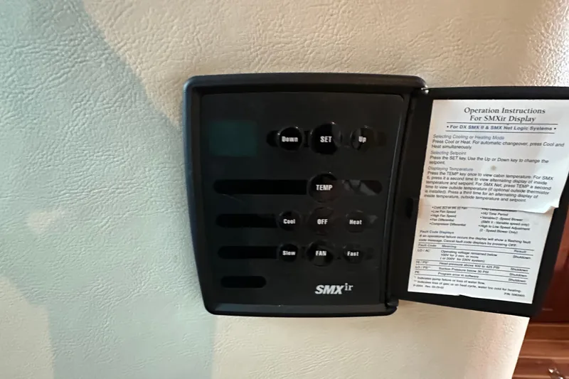 Slide: The Image of SMXir control panel with operation instructions, Riviera 350, 2002 model. - 35