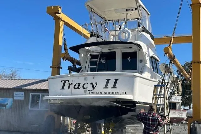Slide: The Image of Riviera 350 boat named "Tracy II" being serviced at a dockyard, Indian Shores, FL. - 8