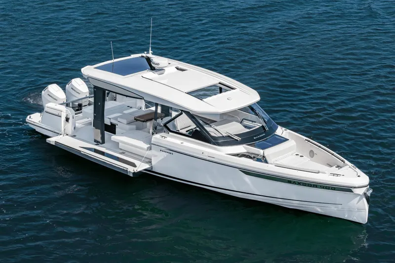 The Image of 2025 Saxdor 400 GTO luxury boat on calm blue water. - 0