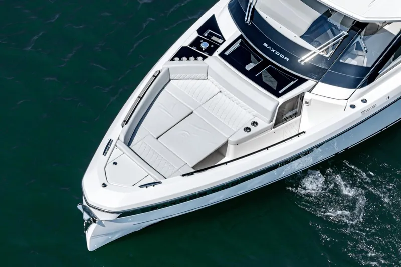 Slide: The Image of 2025 Saxdor 400 GTO luxury yacht cruising on clear water. - 12