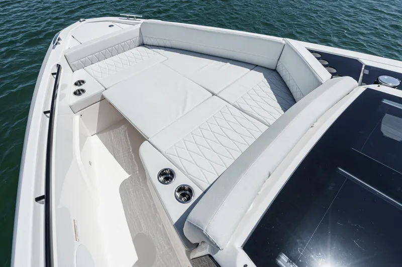 Slide: The Image of Luxurious seating area on 2025 Saxdor 400 GTO boat, featuring elegant white upholstery. - 14