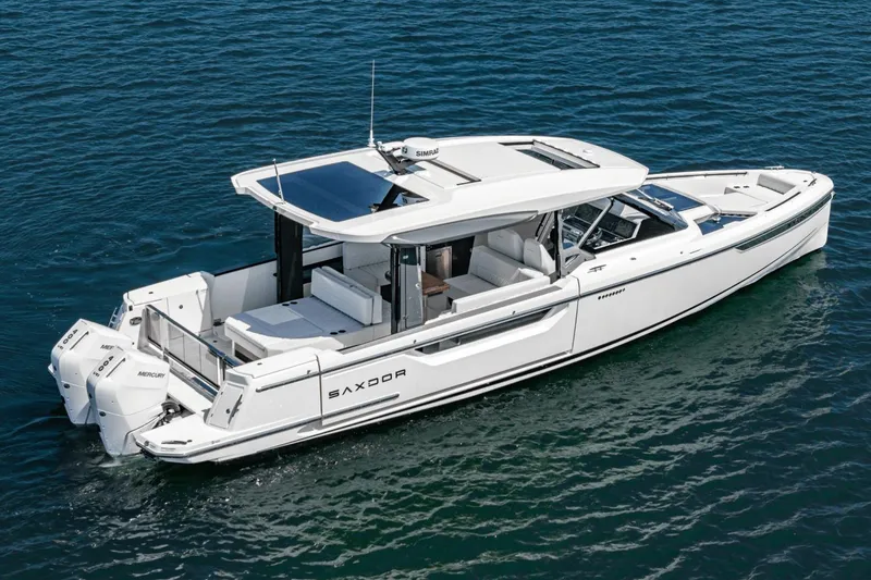 Slide: The Image of 2025 Saxdor 400 GTO luxury boat cruising on open water. - 15