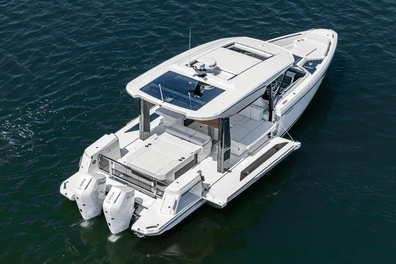 Slide: The Image of 2025 Saxdor 400 GTO boat on water, featuring sleek design and dual engines. - 17