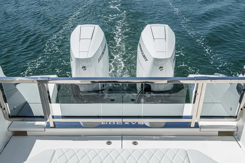 Slide: The Image of 2025 Saxdor 400 GTO boat with dual Mercury outboard engines on water. - 20