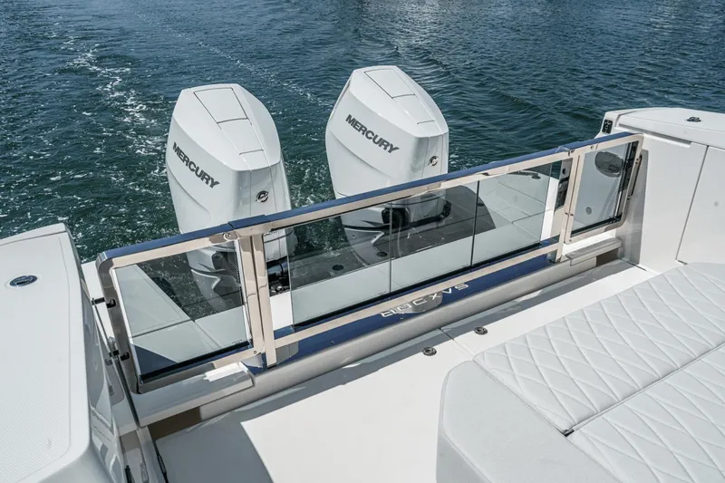 Slide: The Image of 2025 Saxdor 400 GTO boat with dual Mercury engines on water. - 21