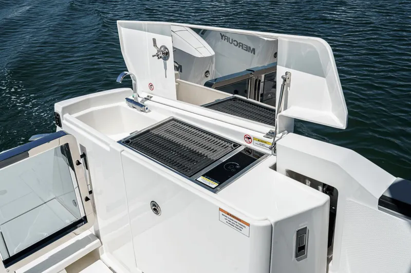 Slide: The Image of Outdoor kitchen on 2025 Saxdor 400 GTO boat with grill and sink. - 22