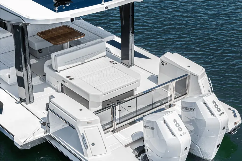 Slide: The Image of 2025 Saxdor 400 GTO boat with dual Mercury V10 engines on water. - 27