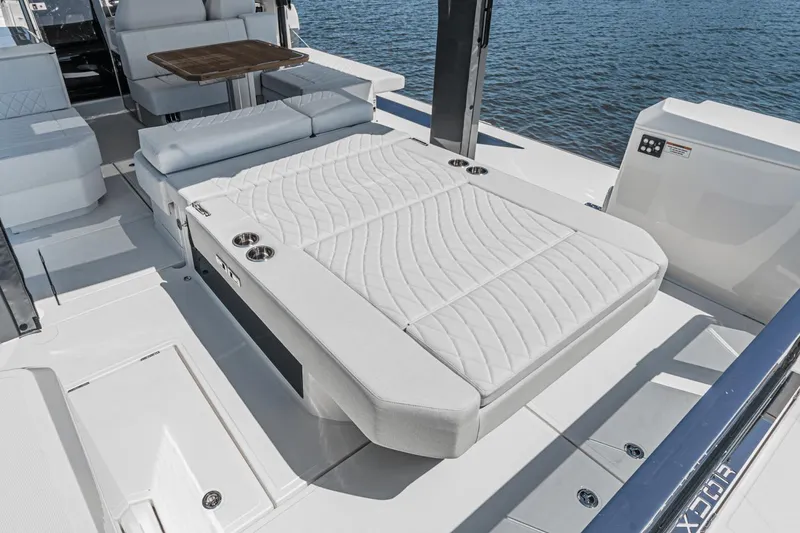 Slide: The Image of 2025 Saxdor 400 GTO yacht interior with luxurious seating and table, overlooking the water. - 28