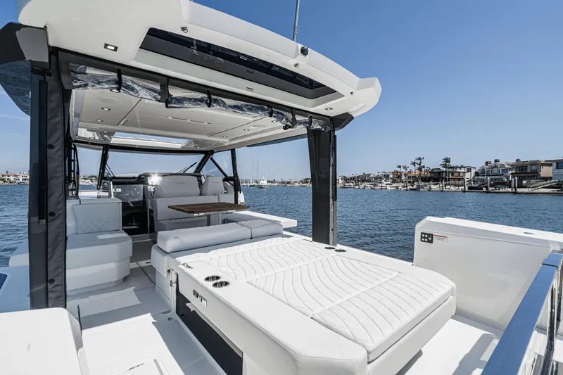 Slide: The Image of 2025 Saxdor 400 GTO luxury yacht interior with sunbed, overlooking marina. - 29
