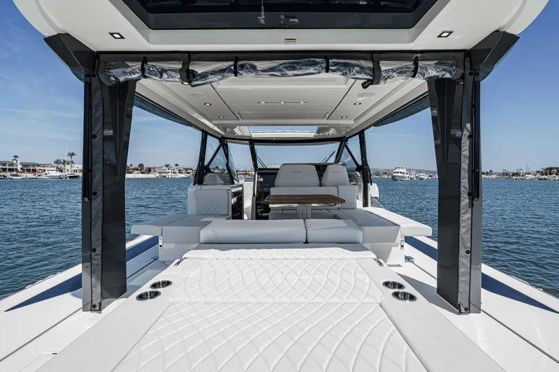 Slide: The Image of 2025 Saxdor 400 GTO luxury boat interior with seating, table, and ocean view. - 33