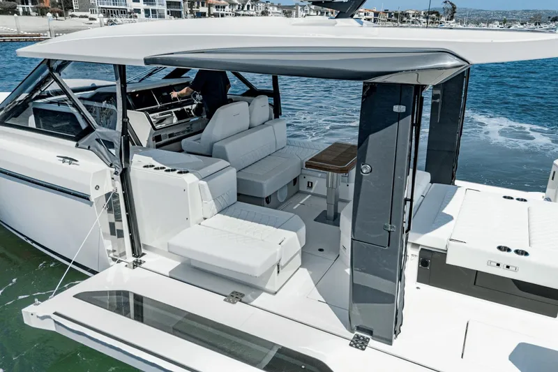 Slide: The Image of 2025 Saxdor 400 GTO luxury boat interior with modern seating and sleek design on the water. - 36