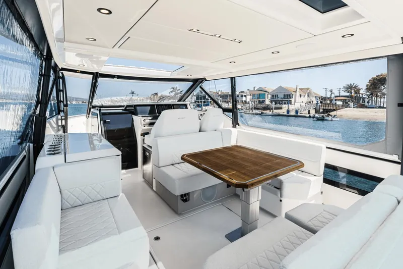 Slide: The Image of Luxurious interior of 2025 Saxdor 400 GTO yacht with elegant seating and waterfront view. - 38