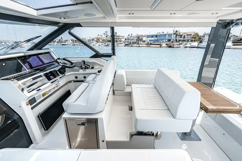 Slide: The Image of 2025 Saxdor 400 GTO luxury yacht interior with modern seating and control panel. - 41