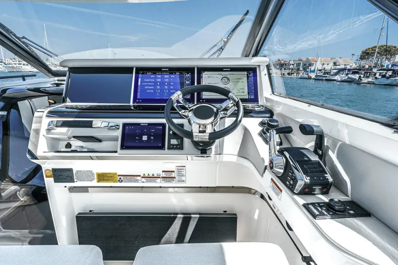 Slide: The Image of Cockpit of 2025 Saxdor 400 GTO yacht with advanced navigation systems and controls. - 44