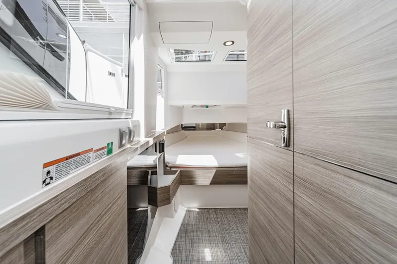 Slide: The Image of Interior of 2025 Saxdor 400 GTO yacht, featuring modern wood paneling and sleek design. - 48