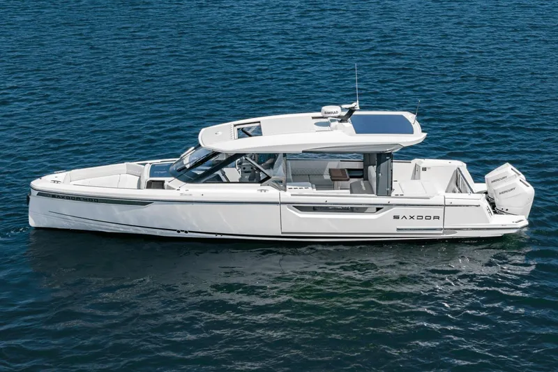 Slide: The Image of 2025 Saxdor 400 GTO luxury boat cruising on open water. - 5