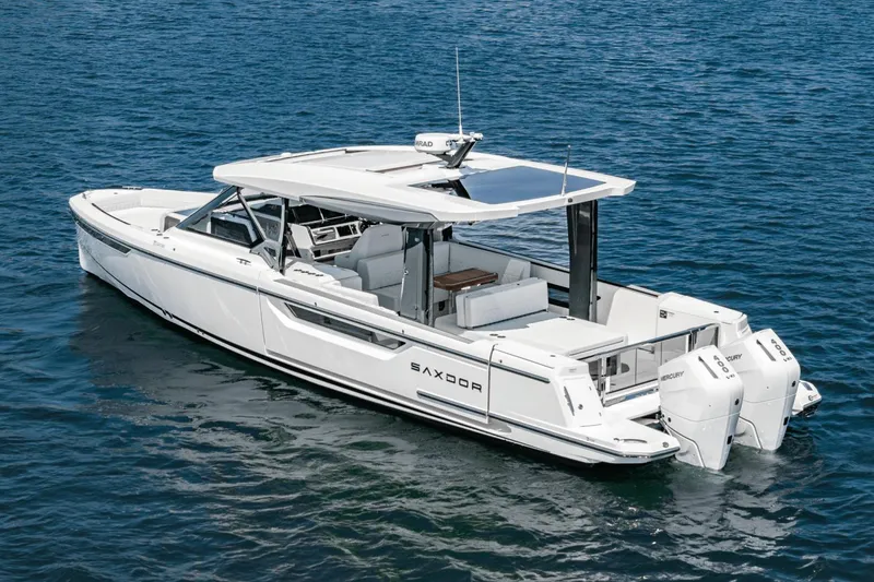 Slide: The Image of 2025 Saxdor 400 GTO luxury boat on water, featuring sleek design and powerful engines. - 8