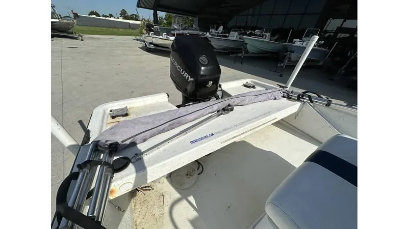 Slide: The Image of 2009 Trophy 181 Bay boat with Mercury engine, docked in a marina. - 13