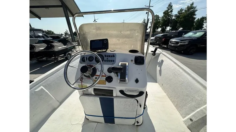 Slide: The Image of 2009 Trophy 181 Bay boat dashboard with steering wheel and controls. - 15