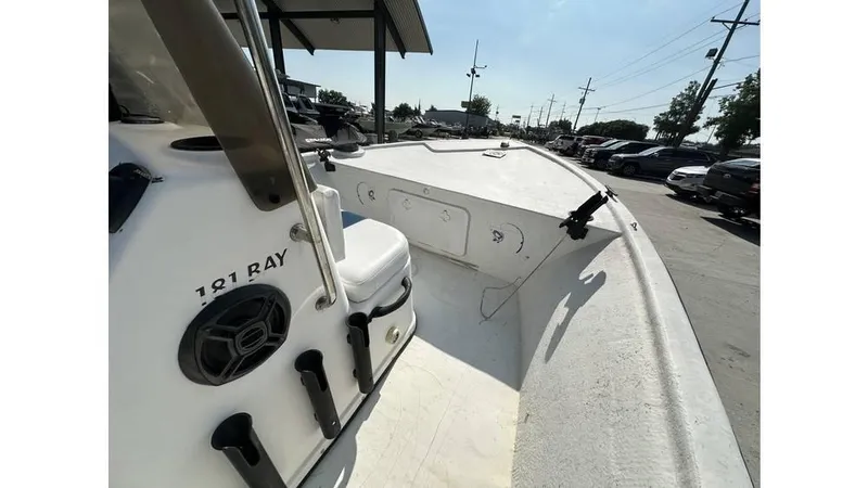 Slide: The Image of 2009 Trophy 181 Bay boat deck view, featuring seating and storage compartments. - 16