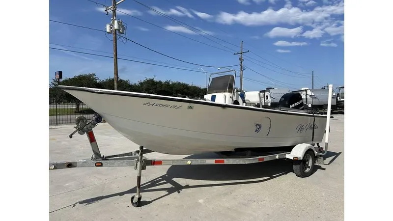 Slide: The Image of 2009 Trophy 181 Bay boat on trailer under clear blue sky. - 7