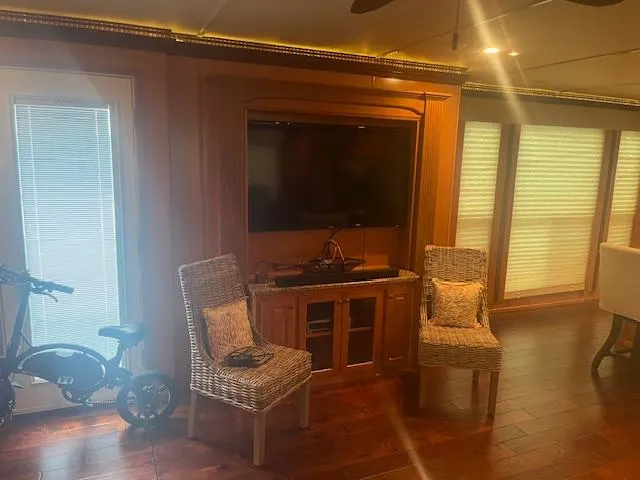 Slide: The Image of Interior of 2009 Horizon 18 x 85 Houseboat with TV, chairs, and bicycle. - 12