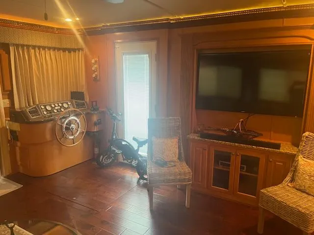 Slide: The Image of Interior of 2009 Horizon 18 x 85 Houseboat with helm, TV, and seating area. - 13