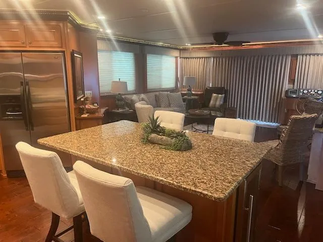 Slide: The Image of Luxurious interior of a 2009 Horizon 18 x 85 houseboat with granite countertops and modern furnishings. - 15