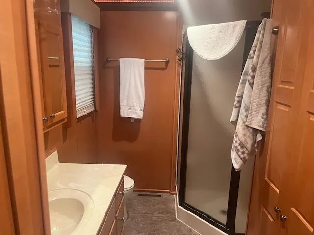 Slide: The Image of Bathroom interior of 2009 Horizon 18 x 85 Houseboat with shower and vanity. - 21